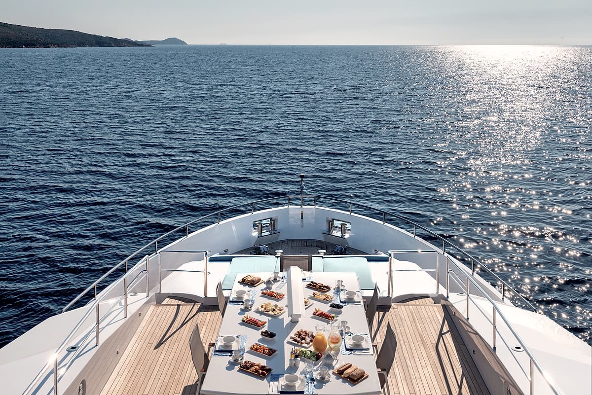A table set for lunch on the bow of Motor Yacht Serenitas