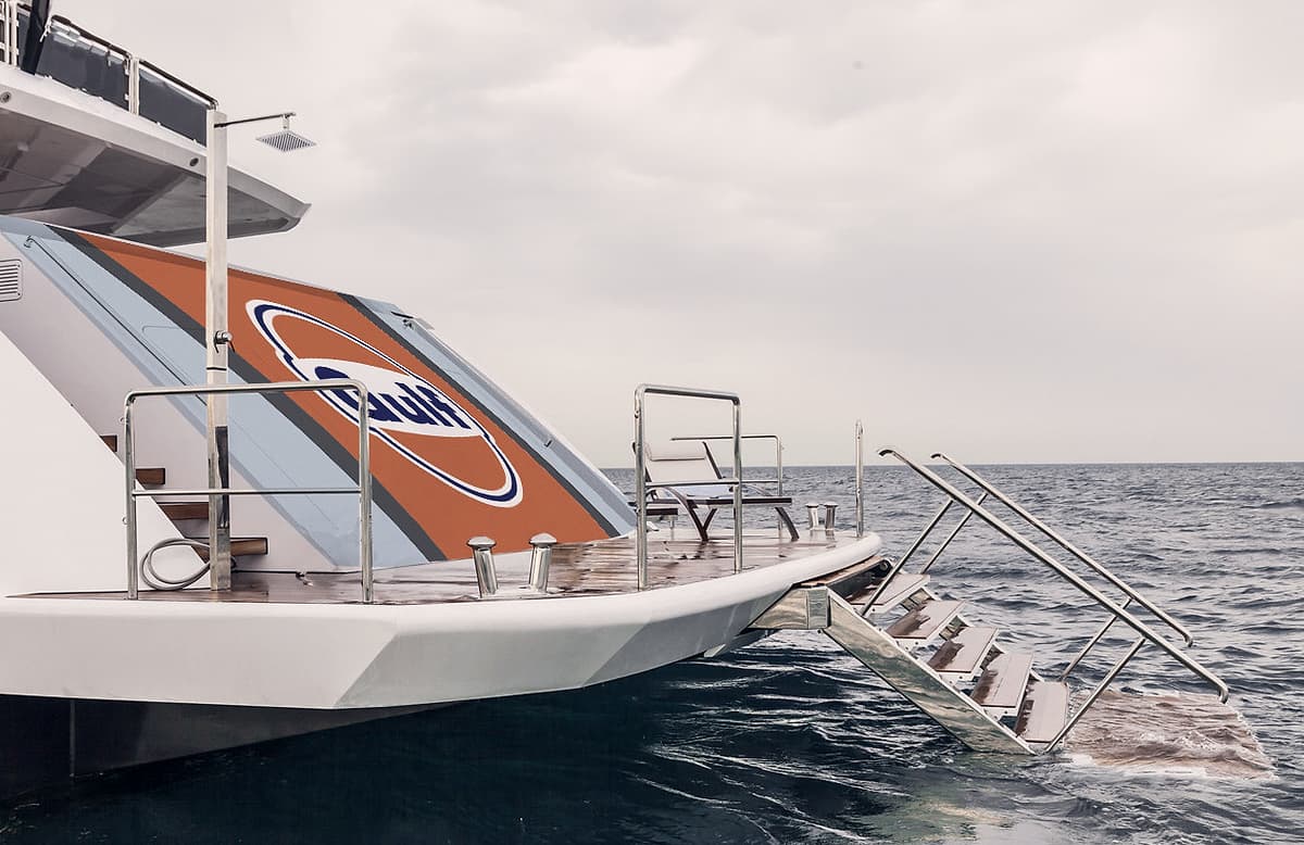 The wrapped stern and swim platform of a superyacht in Gulf livery